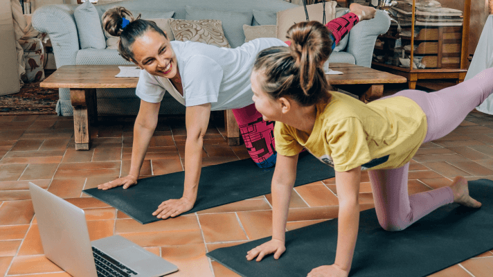 Mother and Daughter doing an online live streamed yoga class together