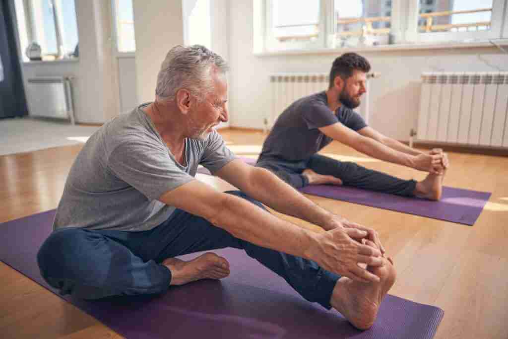 father and son practicing online yoga together