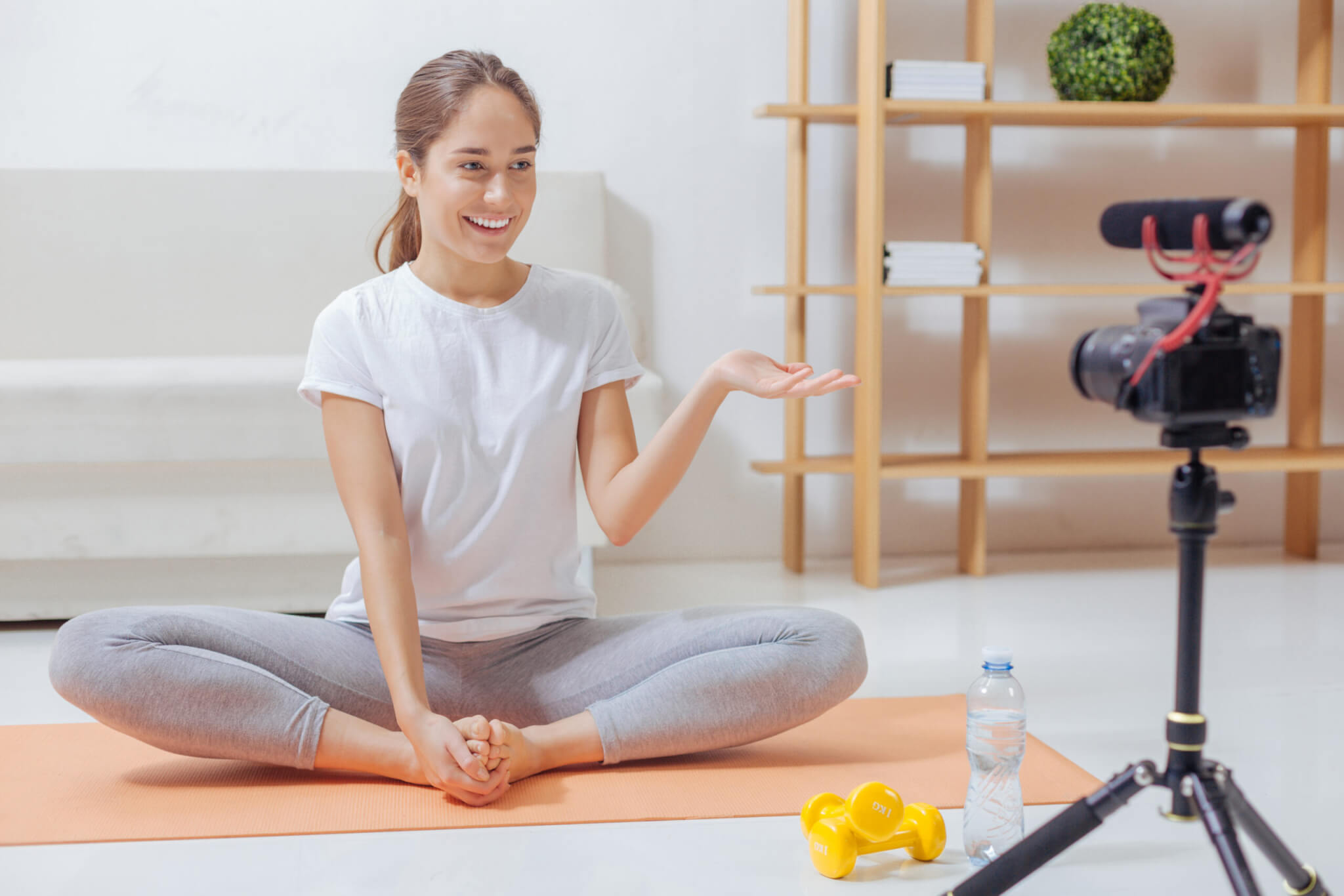 young woman conducting online yoga teacher training