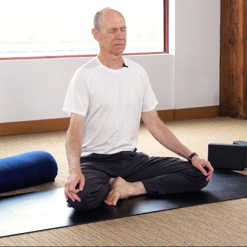 Seated Butterfly Pose (Baddha Konasana) — upright variation with feet together.