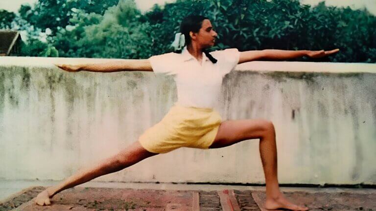 Geeta Iyengar doing warrior 2 yoga pose