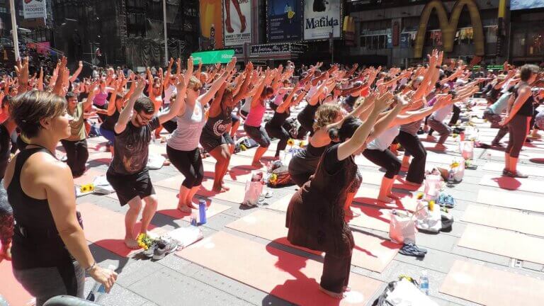 group of people outside practicing on international day of yoga