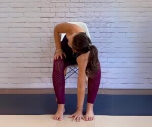 woman doing a folded twisted pose yoga at your desk printable