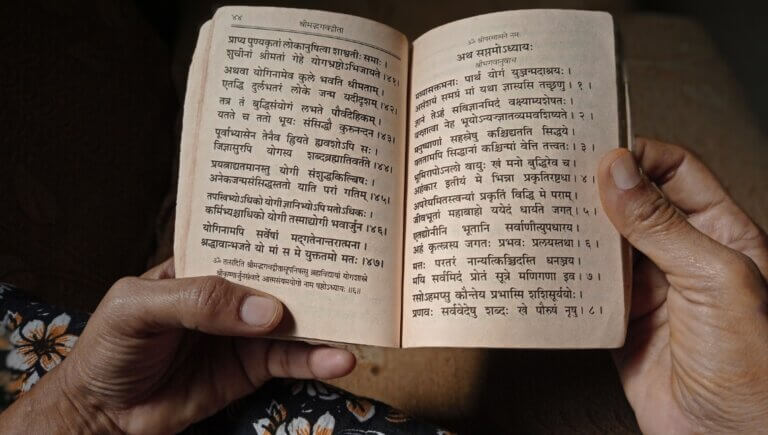 top view of a text containing sanskrit words. yoga terms translated into english