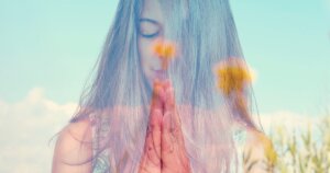 close up of a woman praying using yantras and mantras