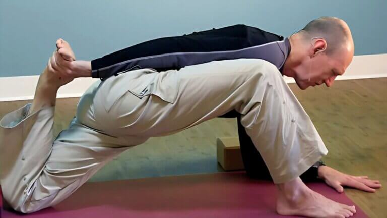 Bernie Clark Demonstrating a Yin Yoga Pose on Youtube