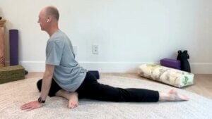 Bernie Clark demonstrating a swan pose in yin Yoga