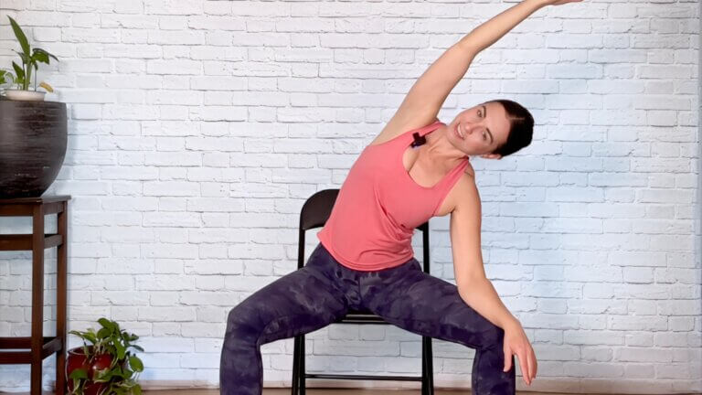 Advanced chair yoga certification – Christina Raskin demonstrating a strong chair yoga pose for strength and flexibility.