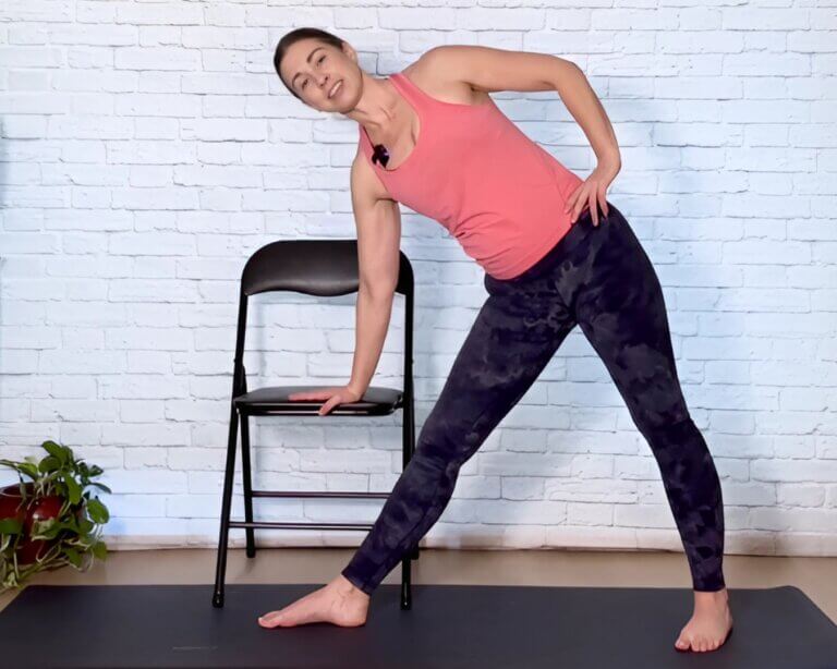 Christina Raskin Demonstrating Advanced Chair Yoga Triangle Pose
