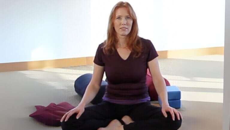 Diana Batts sitting in butterfly pose for an online yin yoga class