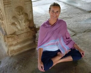Melanie De Villiers sitting crossed legged in a temple near Pune India