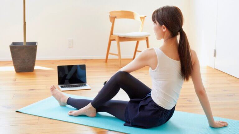 Yoga student enjoying the flexibility of an online RYT-200 Yoga Teacher Training class