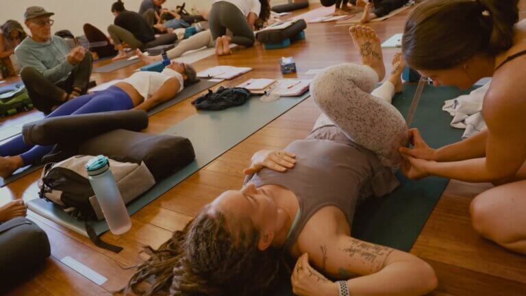 Functional movement demonstration showing hip and spine alignment in yoga pose