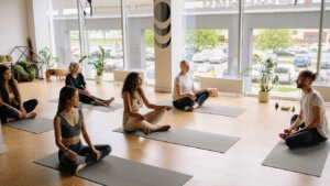 Yoga teacher standing calmly in a studio, representing different teaching archetypes
