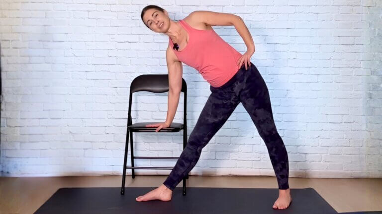 Christina Raskin doing a triangle pose for a chair yoga class
