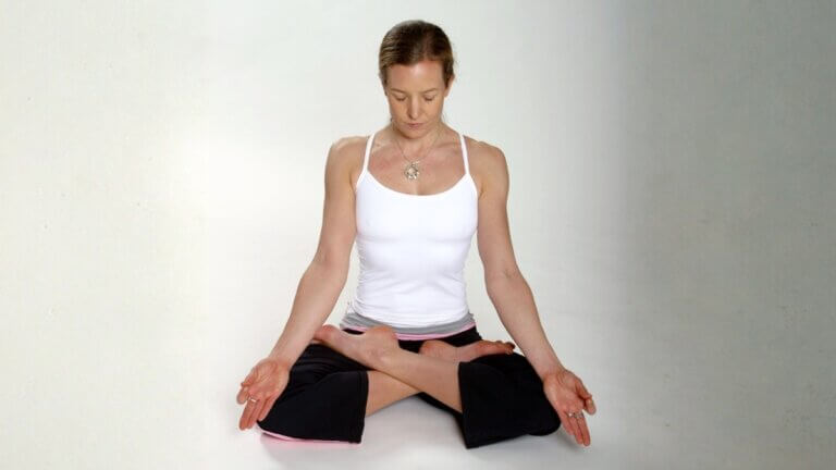 Fiona Stang practicing an advanced Ashtanga yoga posture