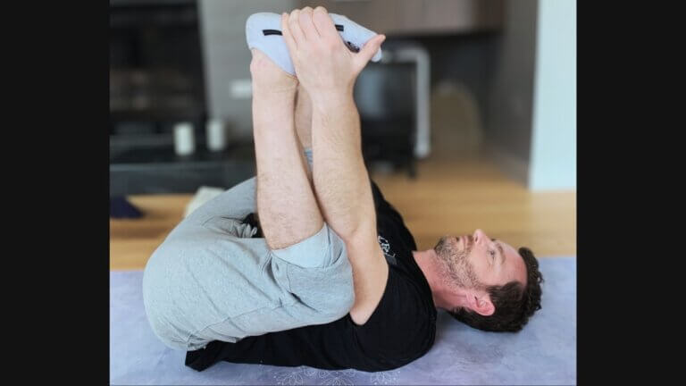 Kevin Parenteau doing Ananda Balasana (Happy Baby yoga pose)