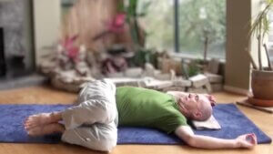 Bernie Clark doing the yin yoga reclining twist pose