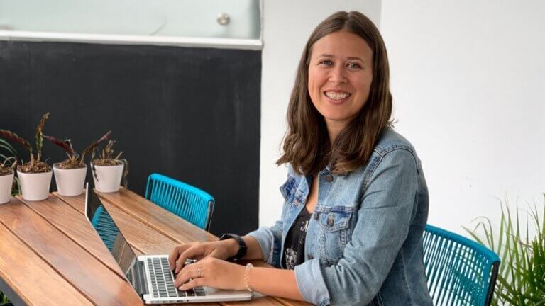 Amanda Kingsmith working at a desk on yoga business planning