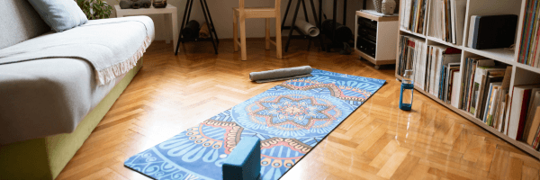 Yoga mat and prop in home yoga studio image for newsletter
