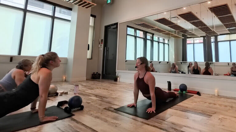 Yoga and strength-based movement during Yoga Sculpt Teacher Training